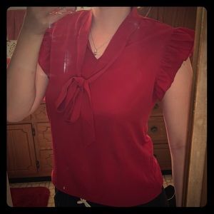 Red sleeveless blouse